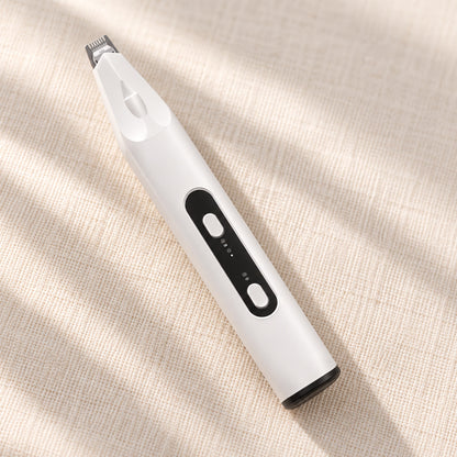 PawShave oppladbar potetrimmer i hvitt med sort kontrollfelt, på lin