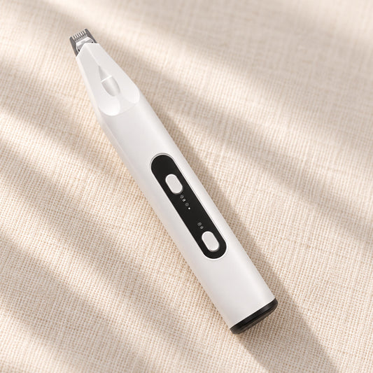 PawShave oppladbar potetrimmer i hvitt med sort kontrollfelt, på lin